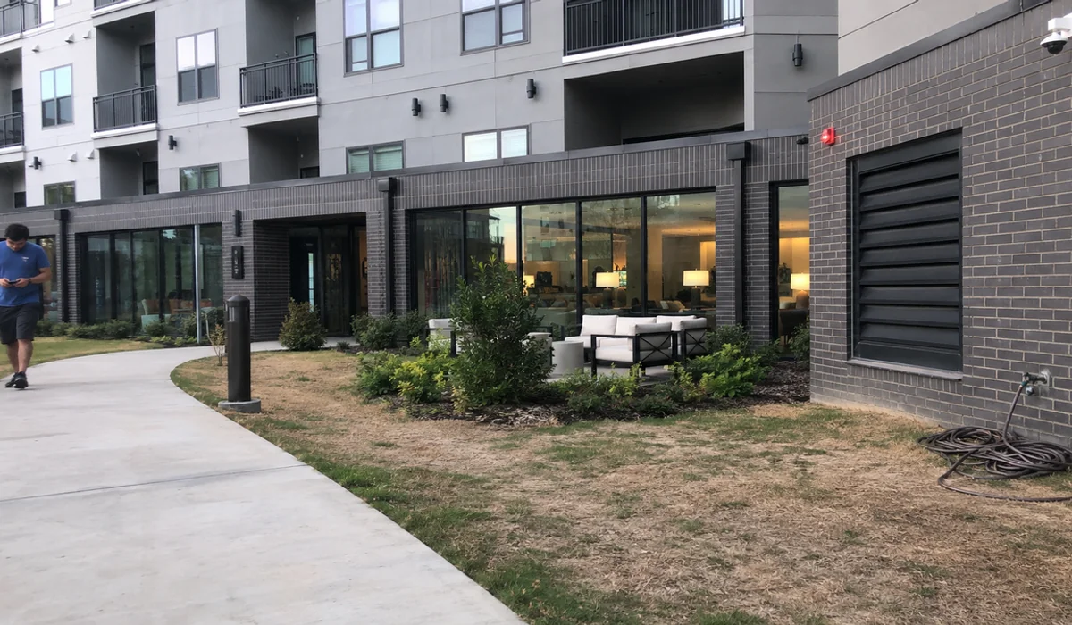 Fort Worth Class A apartment building exterior with balconies and ground-floor leasing office