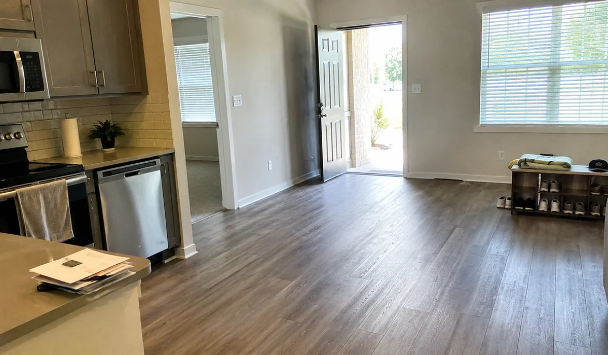 Vacant-ready Fort Worth apartment living room with vinyl plank flooring ready for immediate move-in